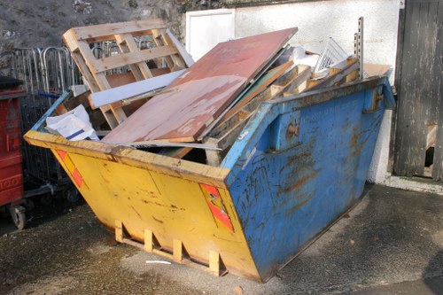 A cluttered garage before clearance in Chiswick